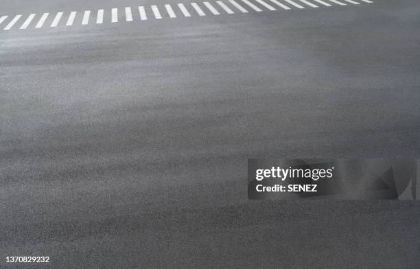 full frame shot of asphalt road - paved driveway stock-fotos und bilder