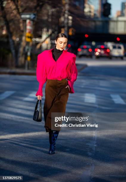 Mary Leest seen wearing pink cropped button up jacket, brown cropped high waist pants, black turtleneck, YSL bag outside Peter Do during New York...