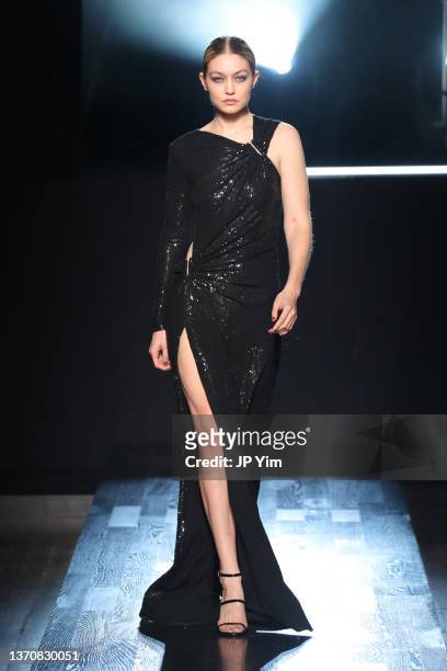 Gigi Hadid walks the runway during Michael Kors Collection Fall/Winter 2022 Runway Show at Terminal 5 on February 15, 2022 in New York City.
