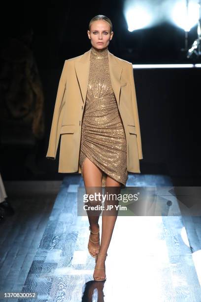 Natasha Poly walks the runway during Michael Kors Collection Fall/Winter 2022 Runway Show at Terminal 5 on February 15, 2022 in New York City.