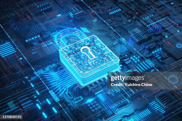 digital data security padlock on futuristic circuit board - seguro fotografías e imágenes de stock