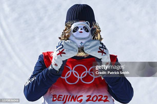 Gold medalist Alexander Hall of Team United States celebrates with stuff animal of the Olympics mascot, Bing Dwen Dwen, during the Men's Freestyle...