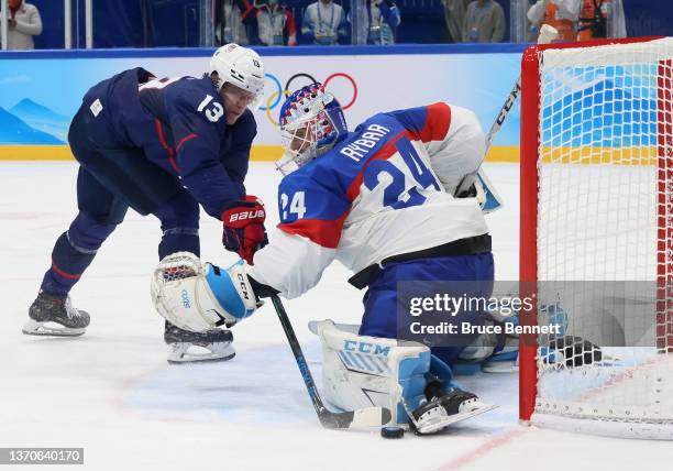 Patrik Rybar of Team Slovakia defends a shot by Nathan Smith of Team United States during the Men’s Ice Hockey Quarterfinal match between Team United...