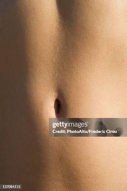 woman's bare stomach, close-up - young women no clothes stock pictures, royalty-free photos & images