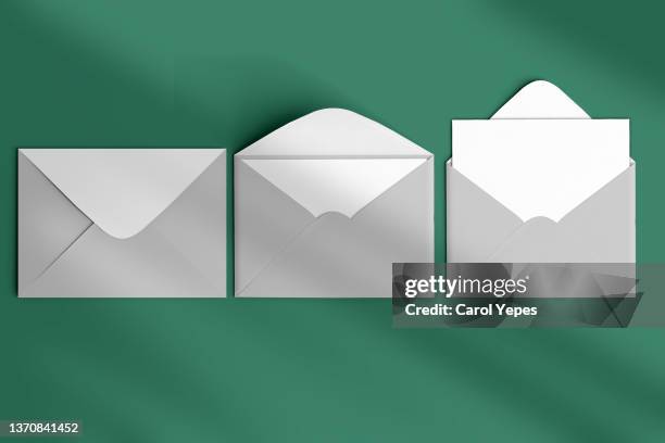 grey semi open envelopes  envelopes background top view - envelope stockfoto's en -beelden
