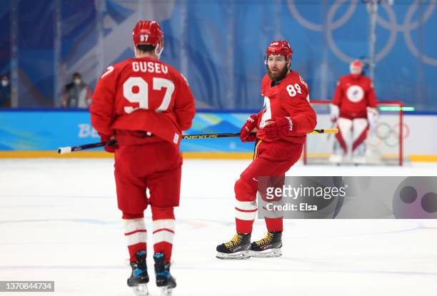 Nikita Nesterov of Team ROC looks to celebrate his second period goal with Nikita Gusev during the Men’s Ice Hockey Quarterfinal match between Team...