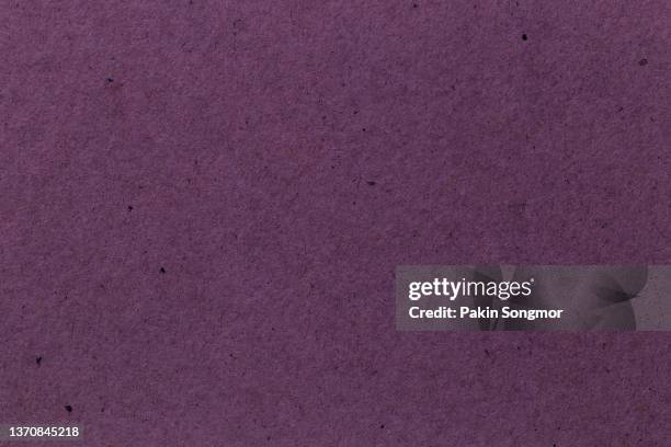 pink colored eco-recycled kraft paper sheet texture was used to create the background. - purple suit stock pictures, royalty-free photos & images