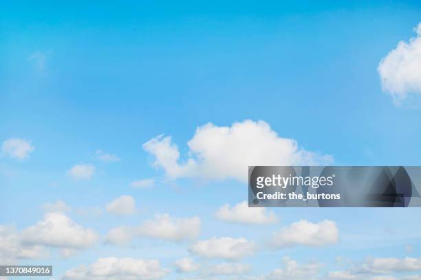 full frame shot of blue sky and clouds, abstract background - cloud sky stock-fotos und bilder