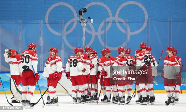 Team Denmark gather together on the ice after their 3-1 loss in the Men’s Ice Hockey Quarterfinal match between Team ROC and Team Denmark on Day 12...