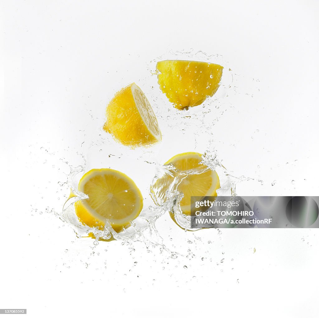 Lemon Halves Falling Into Water