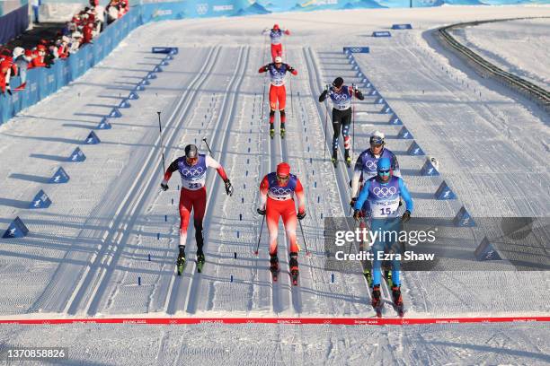 Federico Pellegrino of Team Italy crosses the finish line during the Men's Cross-Country Team Sprint Classic Semifinals on Day 12 of the Beijing 2022...