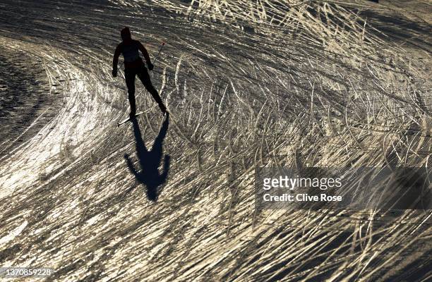 An athlete warms up ahead of the Women's Cross-Country Team Sprint Classic Final on Day 12 of the Beijing 2022 Winter Olympics at The National...