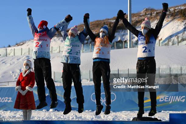Silver medallists Irina Kazakevich, Kristina Reztsova, Svetlana Mironova and Uliana Nigmatullina of Team ROC celebrate during Women's Biathlon 4x6km...