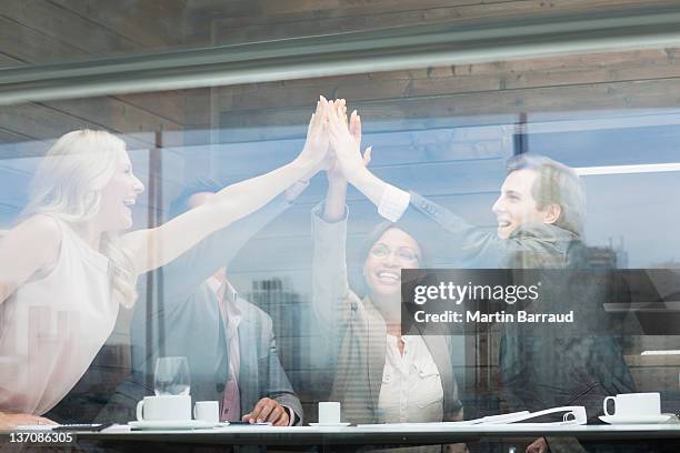 business people joining hands in conference room - hot drink stock pictures, royalty-free photos & images