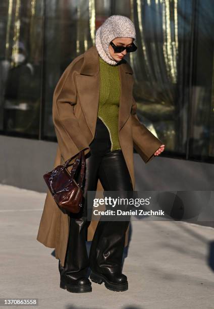 Guests seen outside the Peter Do show during New York Fashion Week A/W 2022 on February 15, 2022 in New York City.