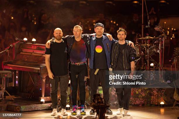 Will Champion, Chris Martin, Jonny Buckland and Guy Berryman of Coldplay perform live on stage at Al Wasl Plaza on February 15, 2022 in Dubai, United...