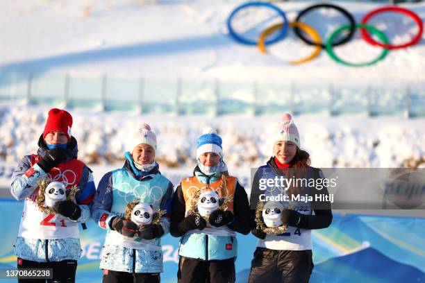 Silver medallists Irina Kazakevich, Kristina Reztsova, Svetlana Mironova and Uliana Nigmatullina of Team ROC pose during Women's Biathlon 4x6km Relay...