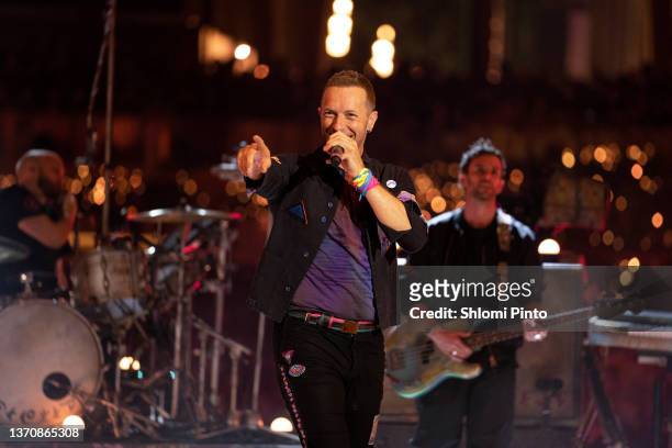 Will Champion, Chris Martin and Guy Berryman of Coldplay perform live on stage at Al Wasl Plaza on February 15, 2022 in Dubai, United Arab Emirates.
