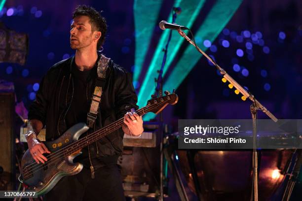 Guy Berryman of Coldplay performs live on stage at Al Wasl Plaza on February 15, 2022 in Dubai, United Arab Emirates.