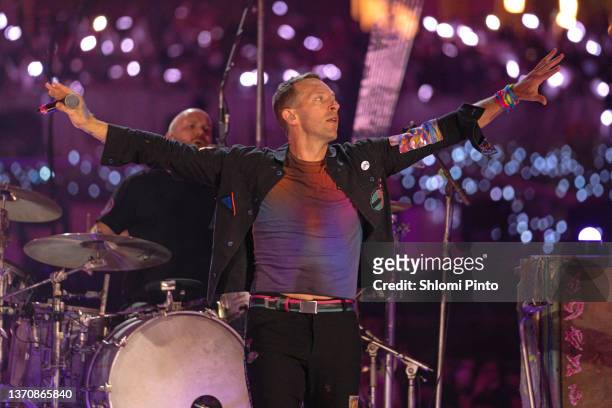 Will Champion and Chris Martin of Coldplay perform live on stage at Al Wasl Plaza on February 15, 2022 in Dubai, United Arab Emirates.