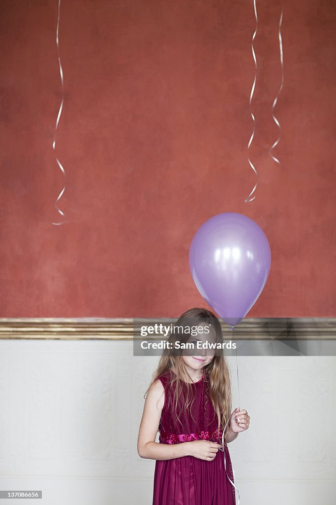 Portrait of smiling girl with balloon