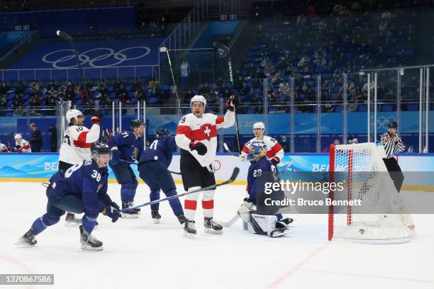 Andres Ambuhl of Team Switzerland celebrates after scoring a goal over Harri Sateri, goaltender of Team Finland in the second period during the Men’s...