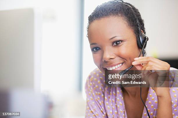 close up portrait of smiling businesswoman with headset - samuser stock pictures, royalty-free photos & images
