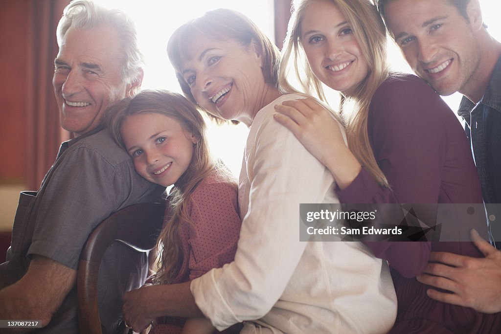 Portrait of smiling multi-generation family in a row
