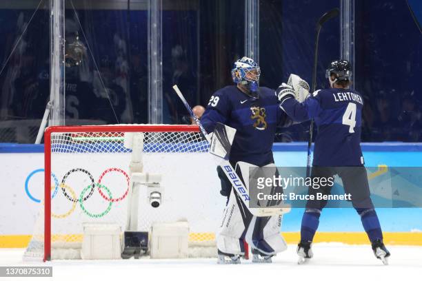 Harri Sateri, goaltender of Team Finland celebrate with team mate Mikko Lehtonen victory after the third period during the Men’s Ice Hockey...