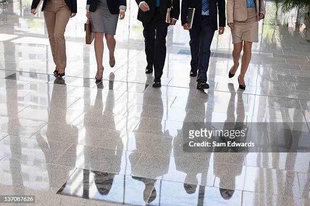 business people walking together - arrival stock pictures, royalty-free photos & images