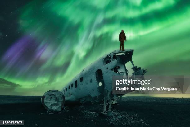 flight to the northern lights, solheimasandur beach, dc-3 plane, golden circle route, vik, iceland - polar climate stock pictures, royalty-free photos & images