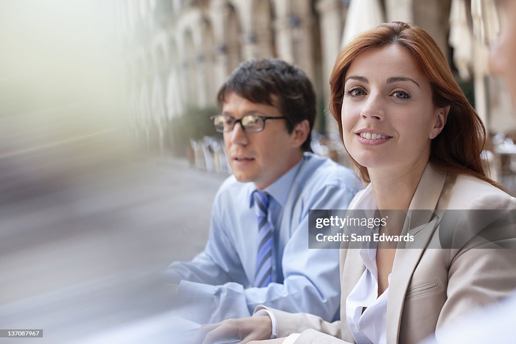 Business people sitting together outdoors