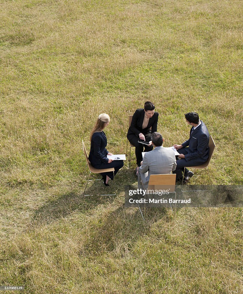 Business people having a meeting outdoors