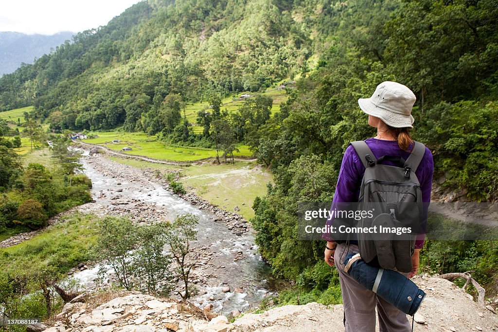 Tourist looking over valley, Nepal