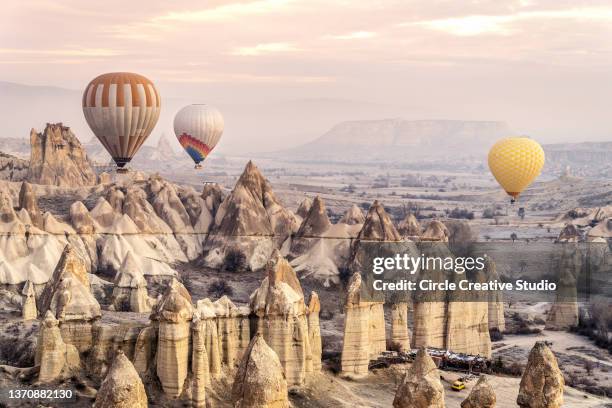 cappadocia valley at sunrise - cappadocia stock pictures, royalty-free photos & images