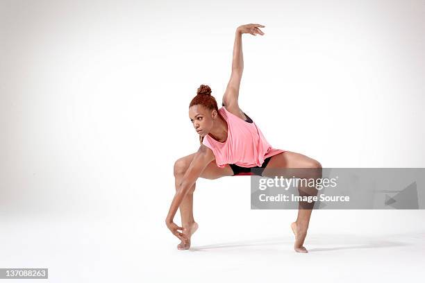 young woman dancing - dancing white background stock pictures, royalty-free photos & images