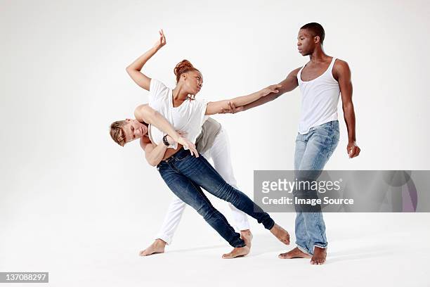 young lovers being separated - balancing act stockfoto's en -beelden