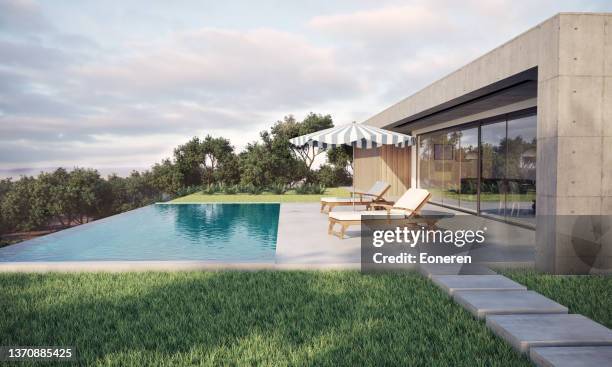maison moderne avec piscine à débordement - immeuble moderne photos et images de collection