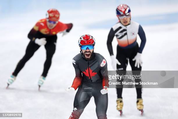 Steven Dubois of Team Canada celebrates winning the Gold medal during the Men's 5000m Relay Final A on day twelve of the Beijing 2022 Winter Olympic...