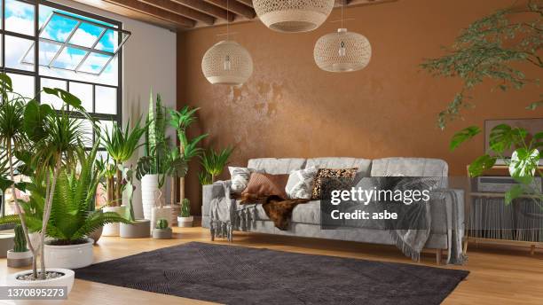 boho stlye salon confortable avec canapé et plantes vertes - tapis décoratif photos et images de collection