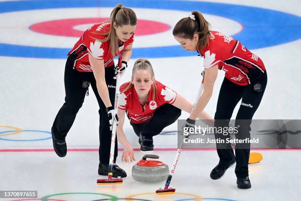 Jocelyn Peterman, Dawn McEwen and Kaitlyn Lawes of Team Canada compete against Team China during the Women's Round Robin Session on Day 12 of the...