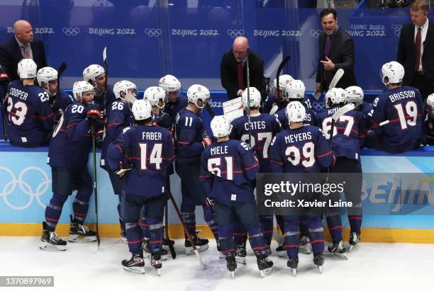 Head coach David Quinn of Team United States react with his players during the Men’s Ice Hockey Quarterfinal match between Team United States and...