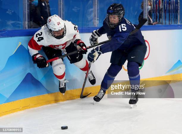 Noemi Ryhner of Team Switzerland and Minnamari Tuominen of Team Finland skate towards the puck in the third period during the Women’s Ice Hockey...