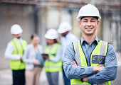 Shot of a mature male architect standing with his arms crossed at a building site