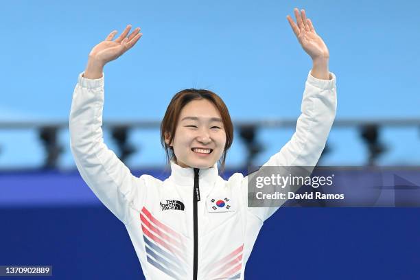 Gold medallist Minjeong Choi of Team South Korea celebrates during the Women's 1500m Final A flower ceremony on day twelve of the Beijing 2022 Winter...