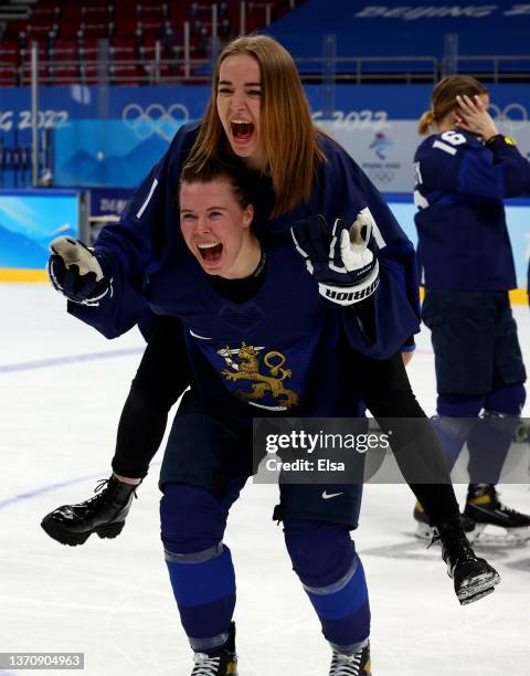 Eveliina Makinen of Team Finland celebrate with team mate Minnamari Tuominen after winning the Women’s Ice Hockey Bronze medal match between Team...