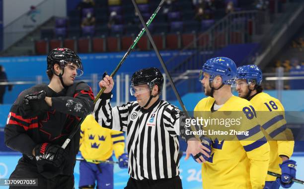 Jack McBain of Team Canada and Theodor Lennstrom of Team Sweden exchange words in the first period during the Men’s Ice Hockey Quarterfinal match...