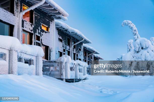 traditional houses covered with snow, lapland - nordic sunrise stock pictures, royalty-free photos & images