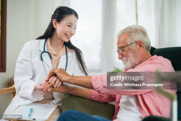 health care concept with geriatric doctor consulting examining elderly senior aged adult in medical exam clinic or hospital - gerontology foto e immagini stock