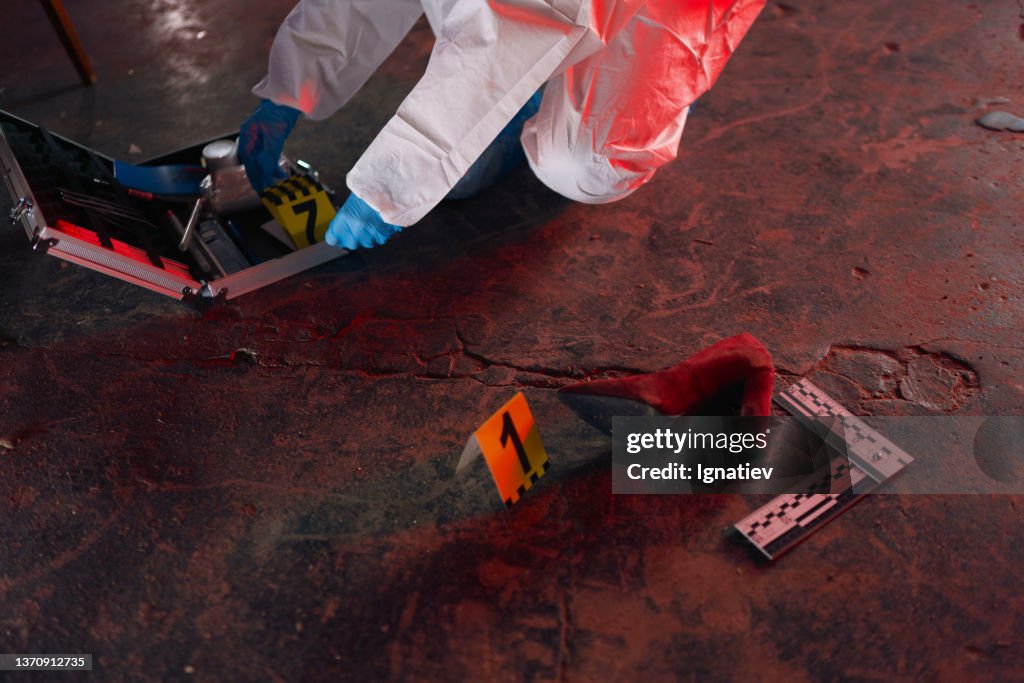 Evidence Red Physical Evidence At The Crime Scene In Red Illumination High-Res Stock ...